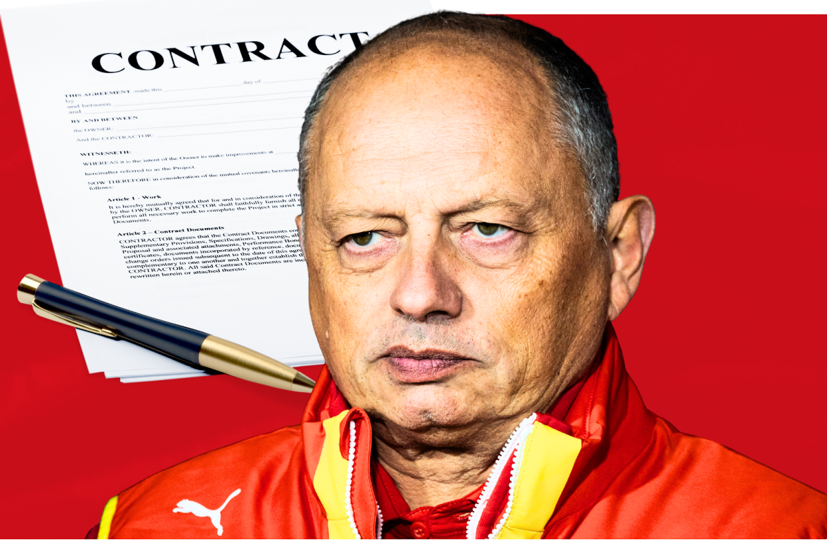 Ferrari boss Fred Vasseur looking annoyed with a contract and pen beside him