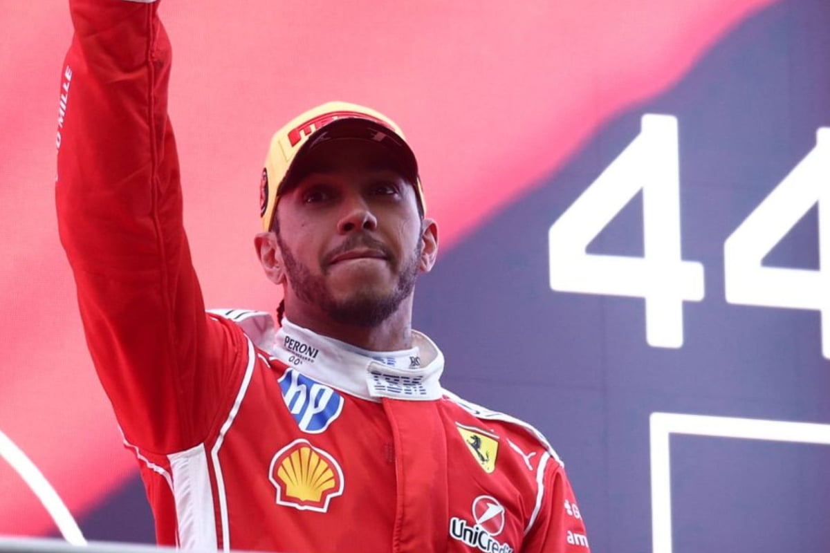 Lewis Hamilton celebrates on the podium with Ferrari at the 2026 Chinese Grand Prix