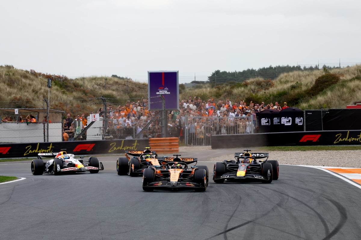 Verstappen drifting behind Piastri during opening lap at Zandvoort