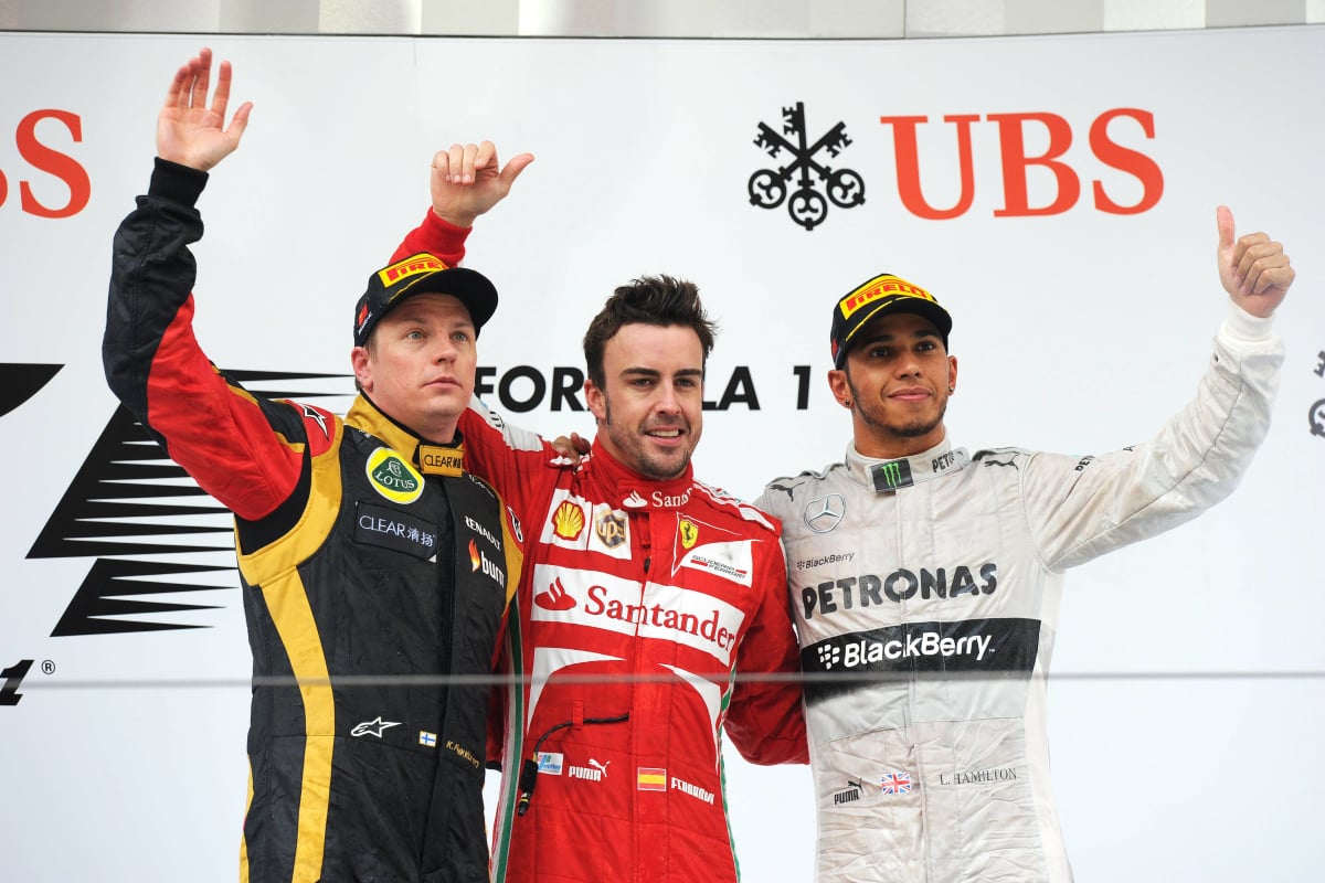 Kimi Raikkonen, Lewis Hamilton, Fernando Alonso stand on the 2013 Chinese Grand Prix podium