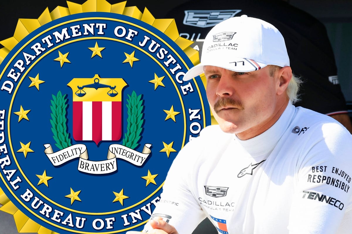 Valtteri Bottas looks across at the FBI logo