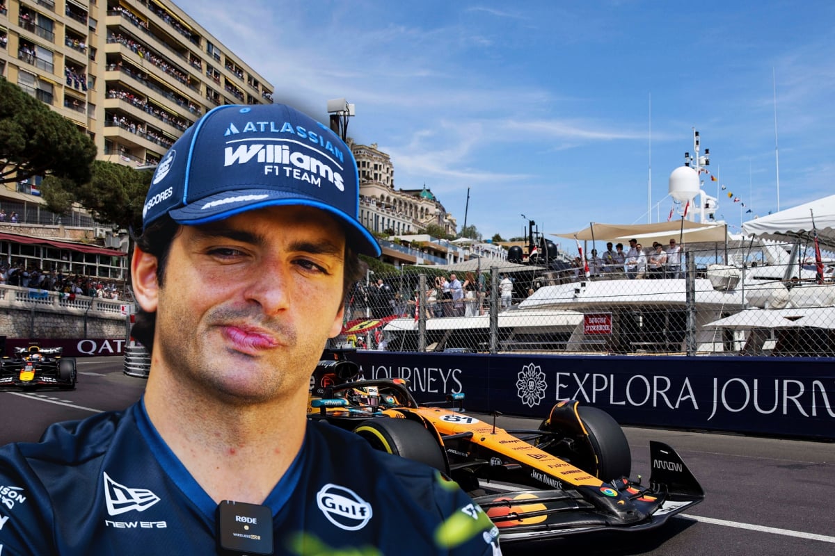Headshot of Sainz overlooking F1 cars on track at the Monaco GP