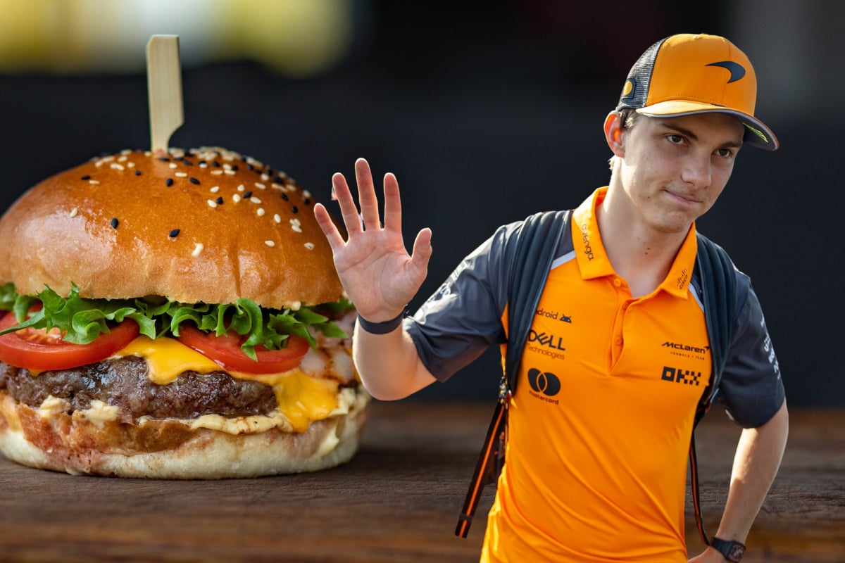 Oscar Piastri waves alongside a composite picture of a hamburger