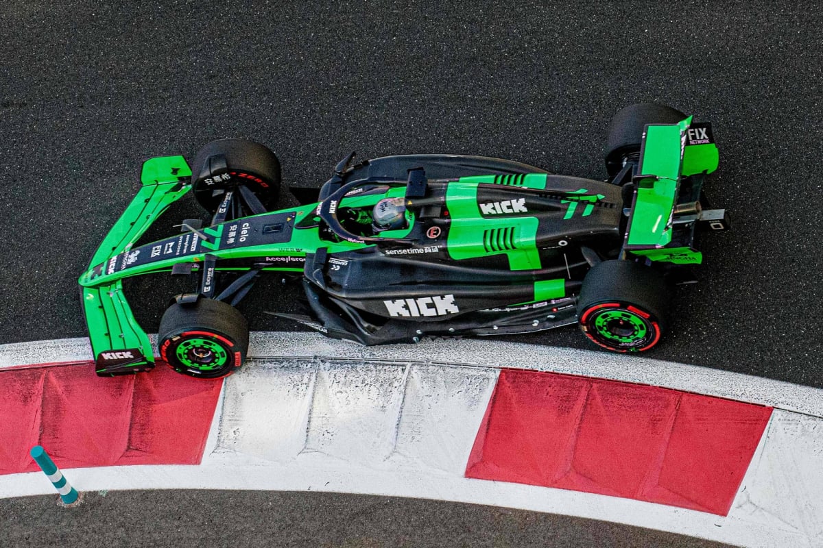 Valtteri Bottas drives a Sauber around the 2024 Abu Dhabi Grand Prix with the Kick sponsor logo visible