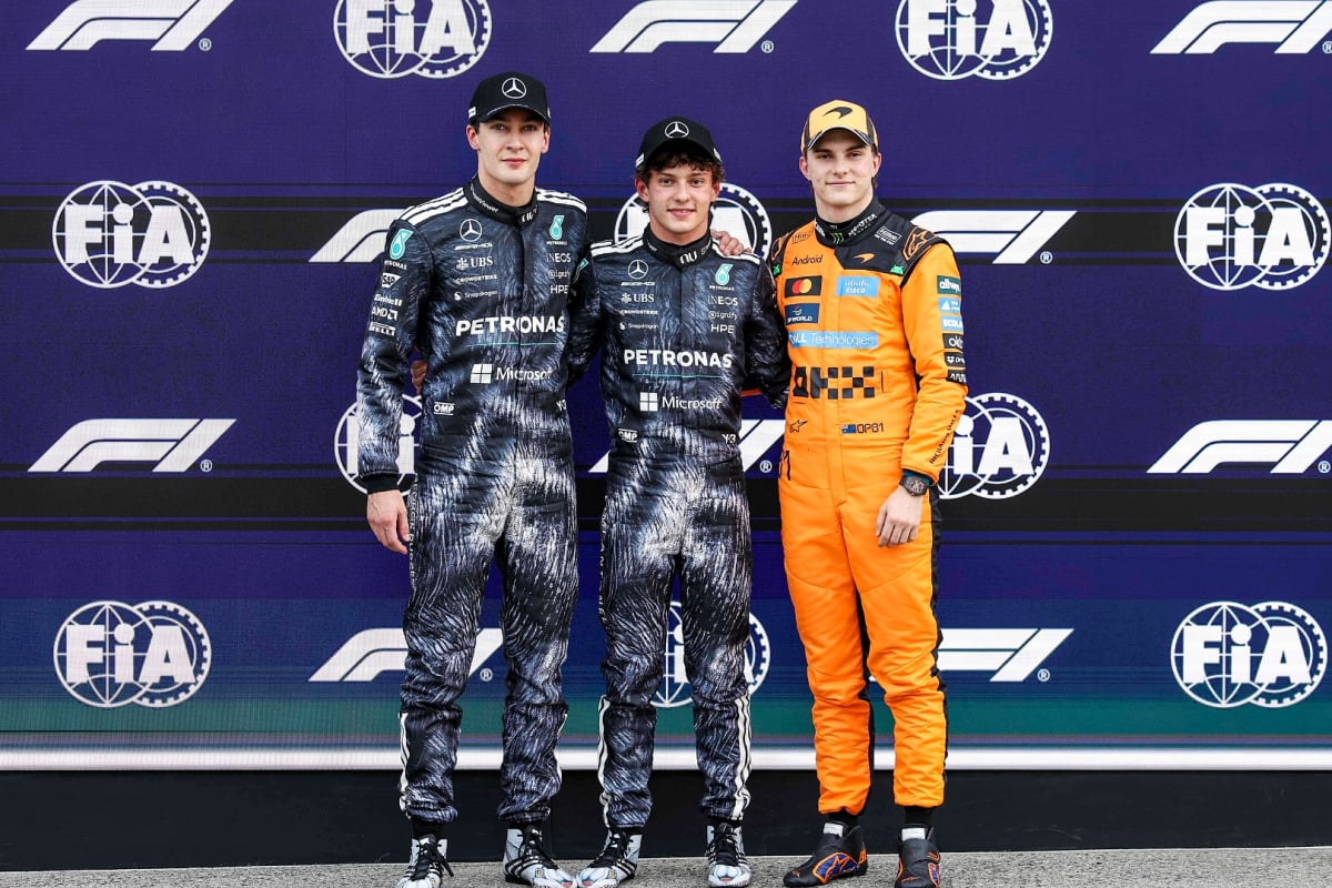 George Russell, Kimi Antonelli and Oscar Piastri posing as the top three after qualifying at the Japanese Grand Prix