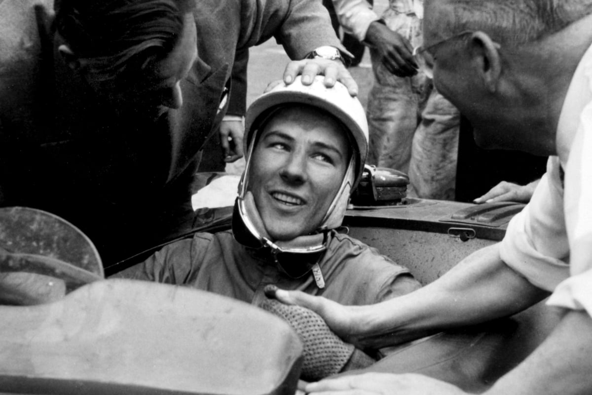 Stirling Moss is congratulated in his car after finishing second in the 1953 Le Mans 24 hours