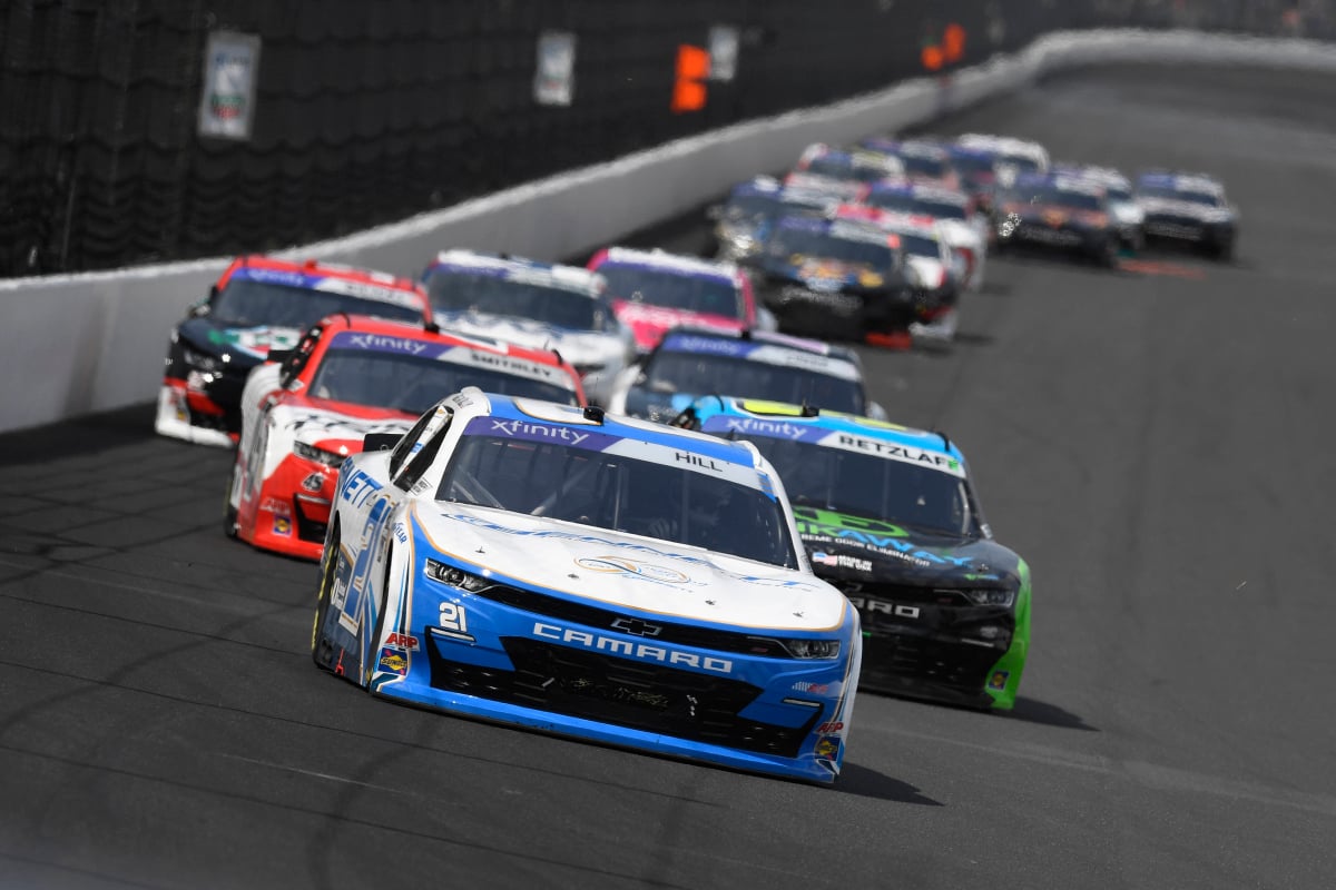 An image of Austin Hill leading a NASCAR Xfinity Series at Indianapolis Motor Speedway
