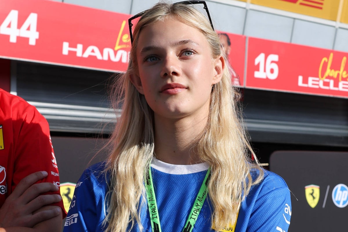 F1 Academy and Ferrari academy driver Alba Larsen outside the Ferrari garage