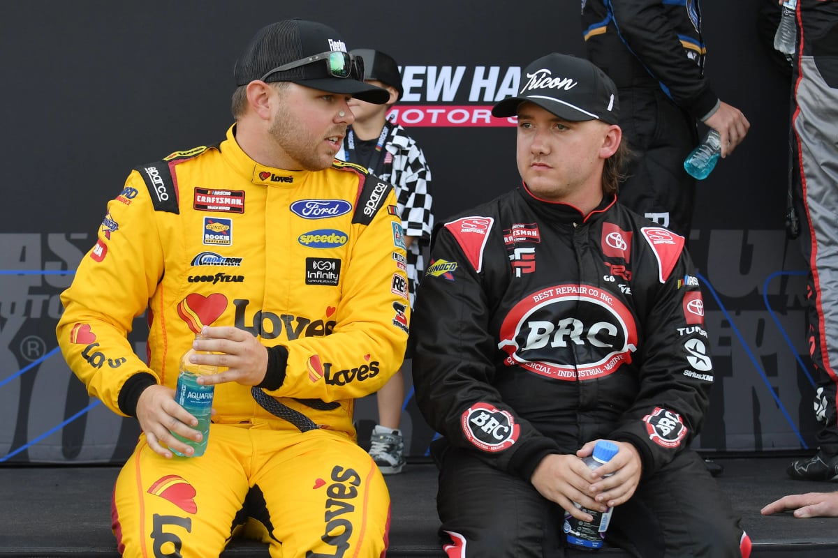 An image of NASCAR drivers Layne Riggs and Brenden Queen in discussion