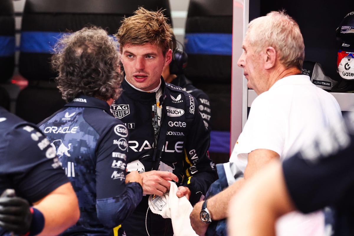 Verstappen, Mekies and Marko discussing in Red Bull garage