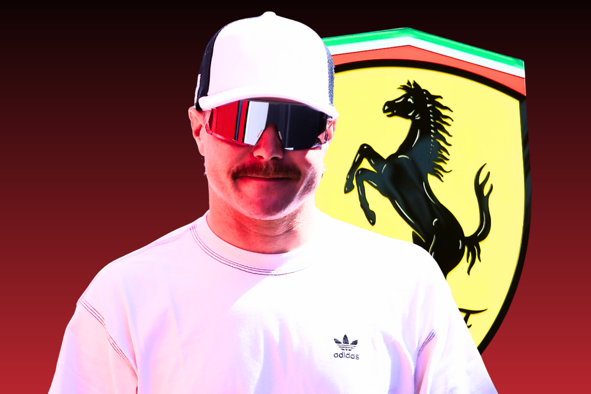 Valtteri Bottas grinning in front of a Ferrari logo