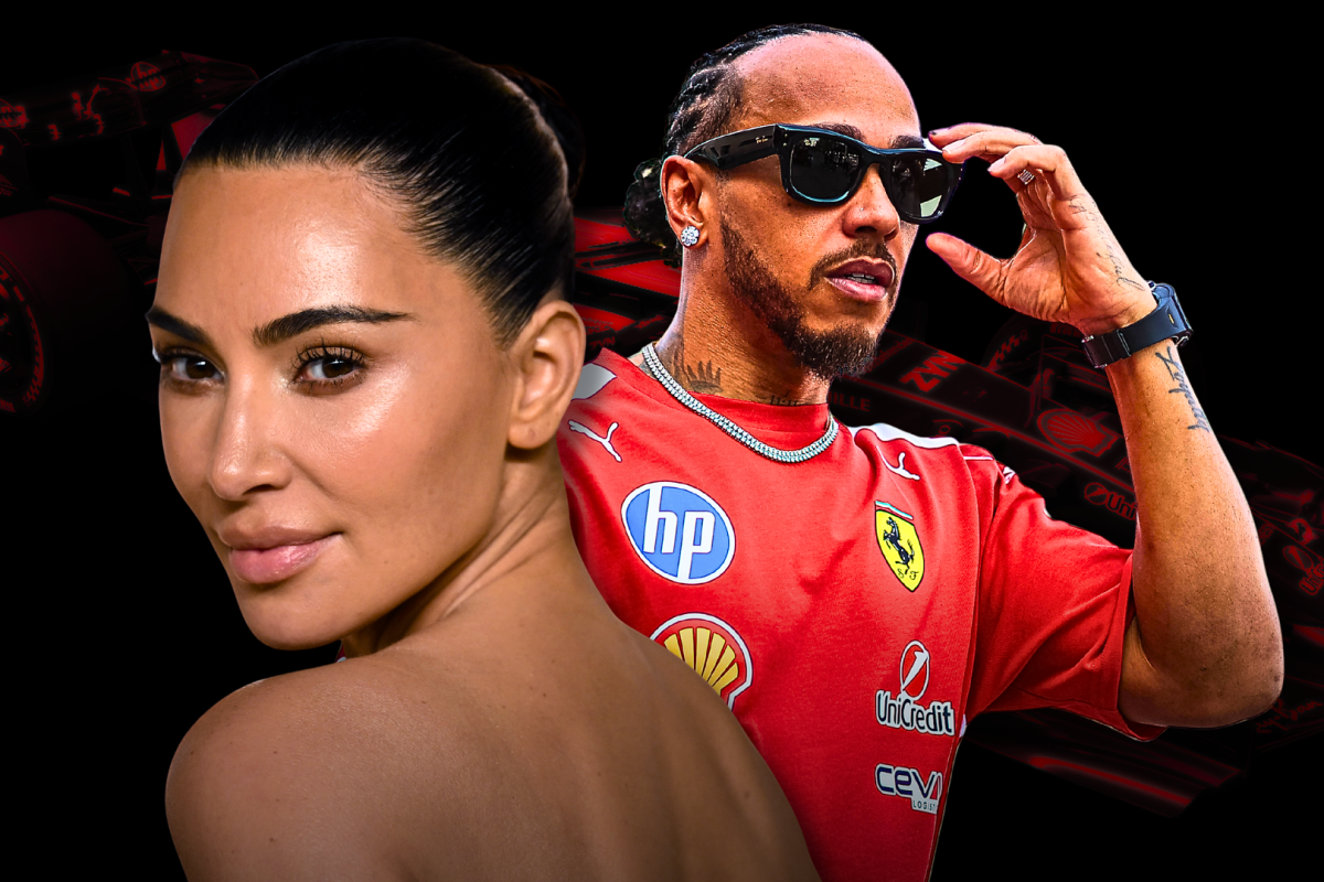 Close up of Kim Kardashian looking over her shoulder with Hamilton in black shades and Ferrari F1 t-shirt with dark black and red Ferrari F1 car background