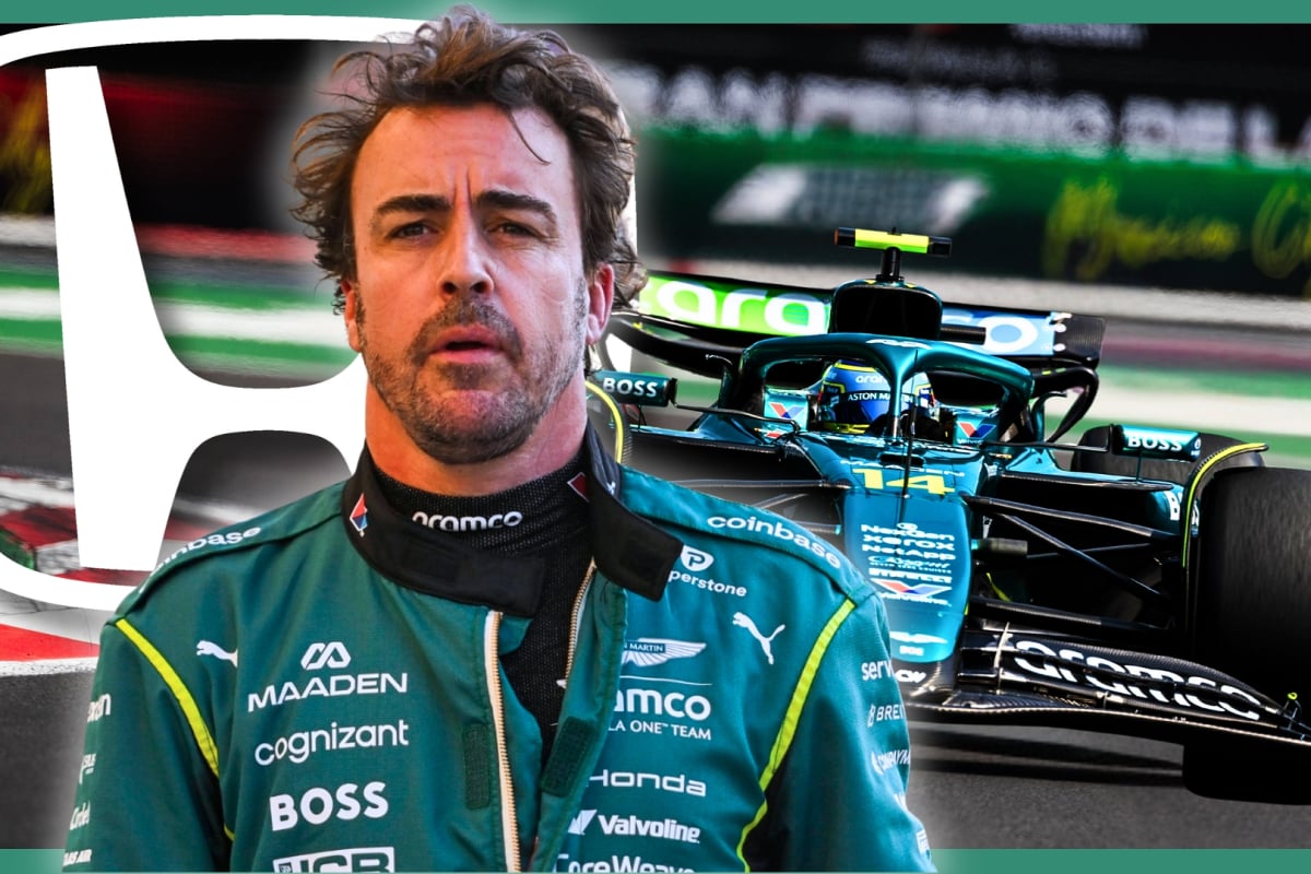 Alonso looking stressed in front of his Aston Martin F1 car on track with the white Honda logo behind him