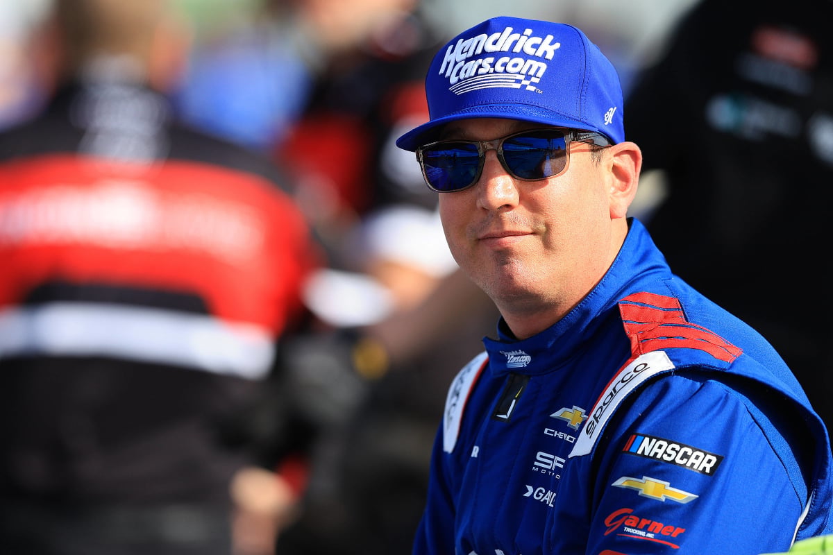 An image of NASCAR champion Kyle Busch smiling ahead of a Truck Series race