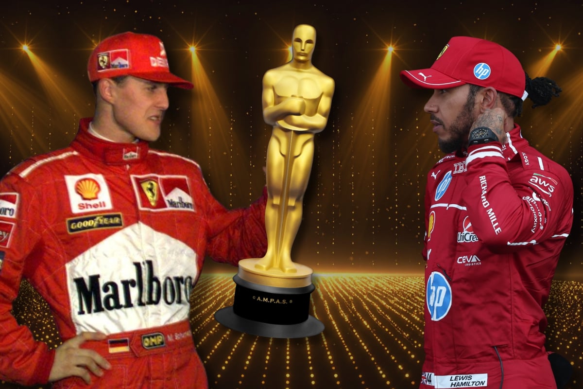 Michael Schumacher holds an Oscar statue as Lewis Hamilton looks on