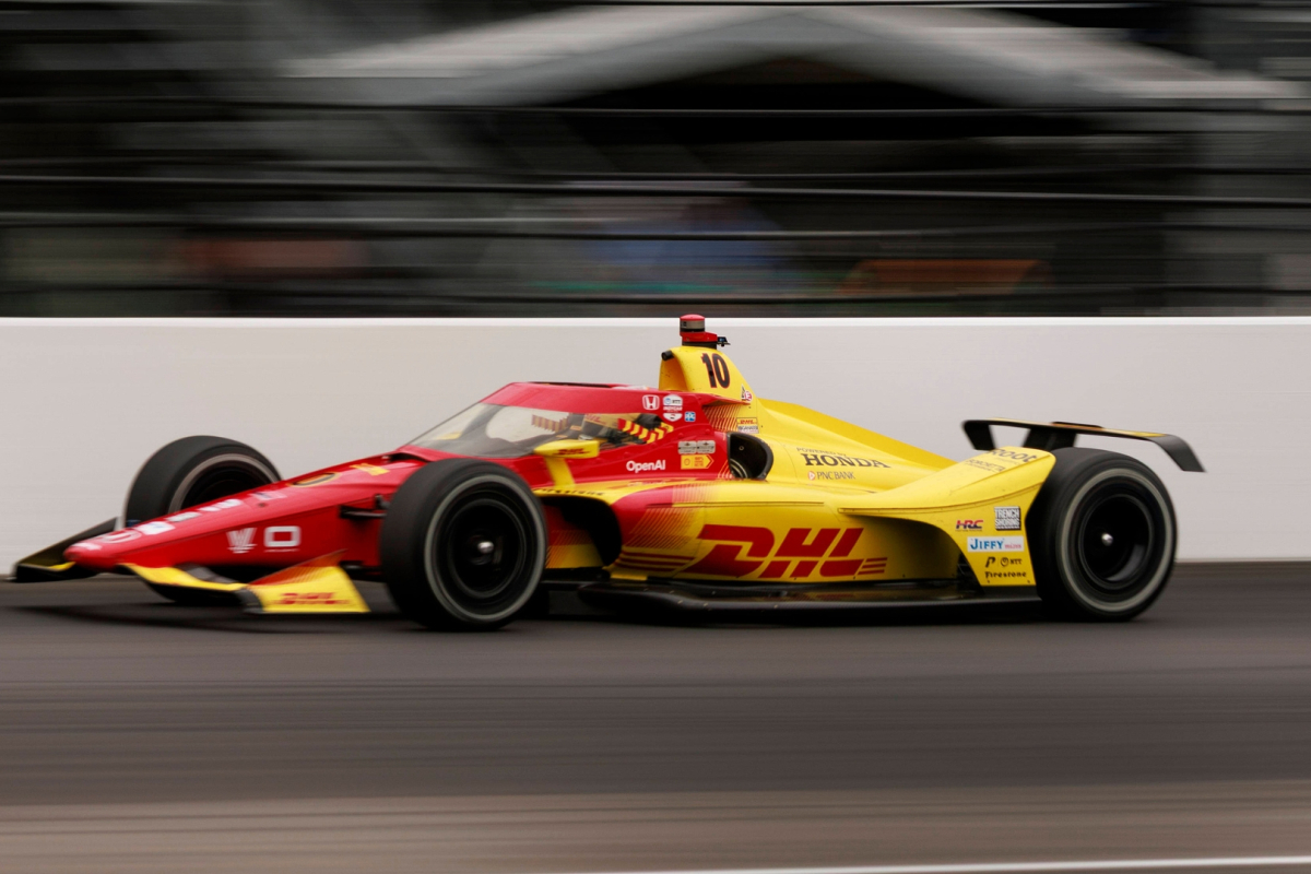 An image of IndyCar champion Alex Palou driving on his way to victory at the 2025 Indy 500