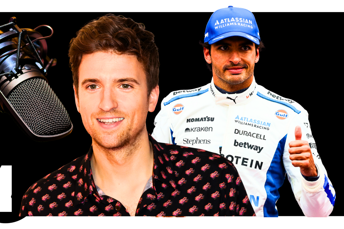 Carlos Sainz and Greg James in front of a BBC Radio 1 logo