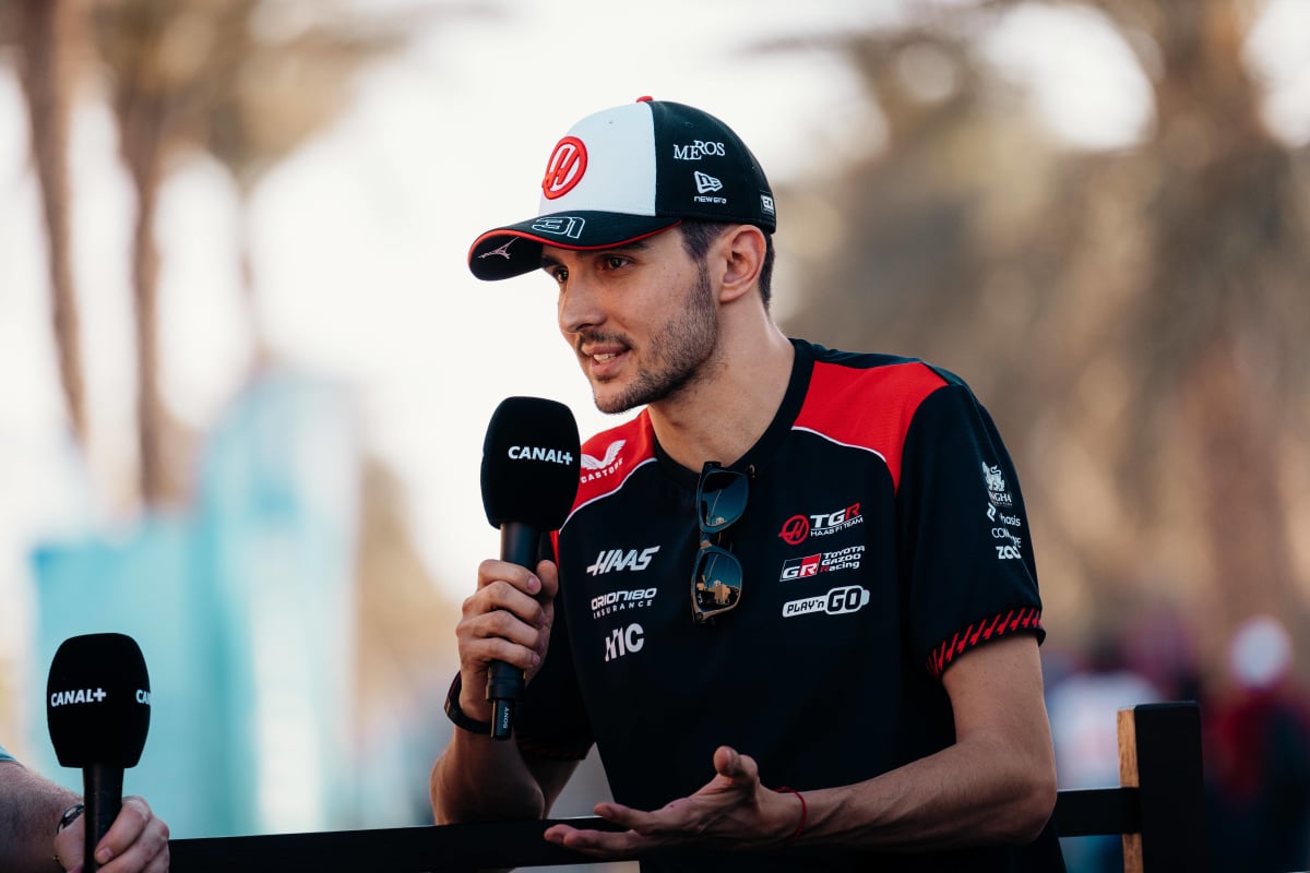 An image of Haas F1 star Esteban Ocon speaking to the media