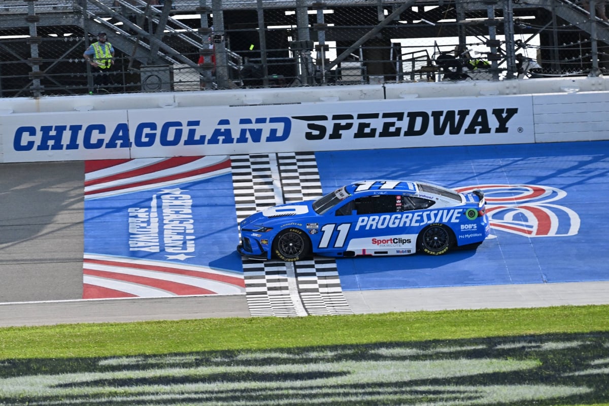 An image of NASCAR star Denny Hamlin crossing the finish line at Chicagoland Speedway