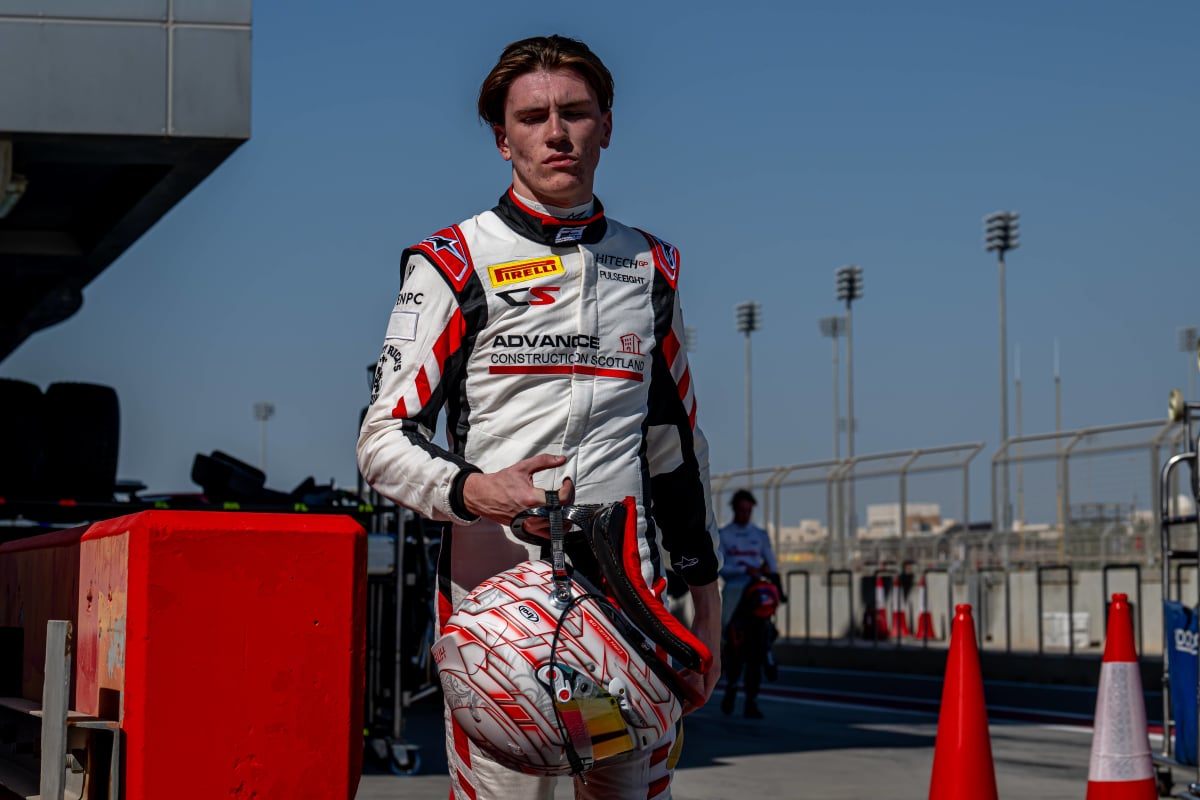 Cian Shields looking disappointed in his race gear after an F2 race