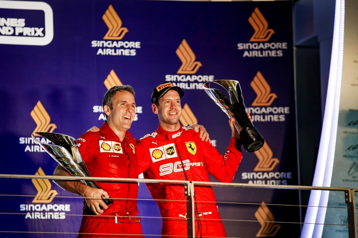 Inaki Rueda on the podium with Sebastian Vettel for Ferrari at the 2019 Singapore GP