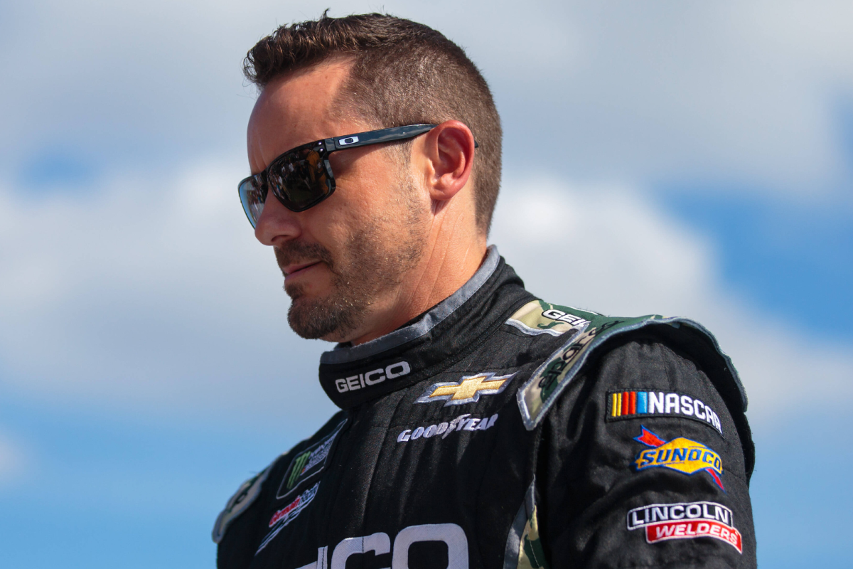 A generic image of NASCAR driver Casey Mears looking to the ground