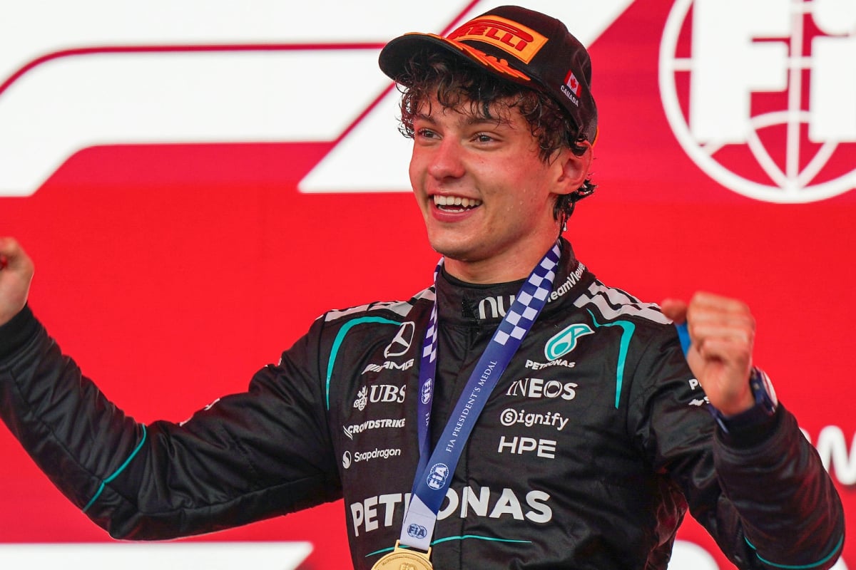 Antonelli on top step of 2026 Canadian GP podium in Pirelli cap with thumbs up