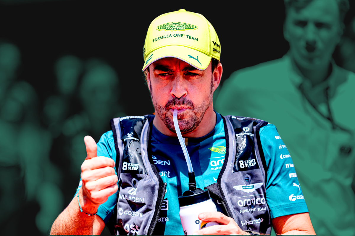 Alonso in green Aston Martin kit with water bottle in mouth giving a thumbs up