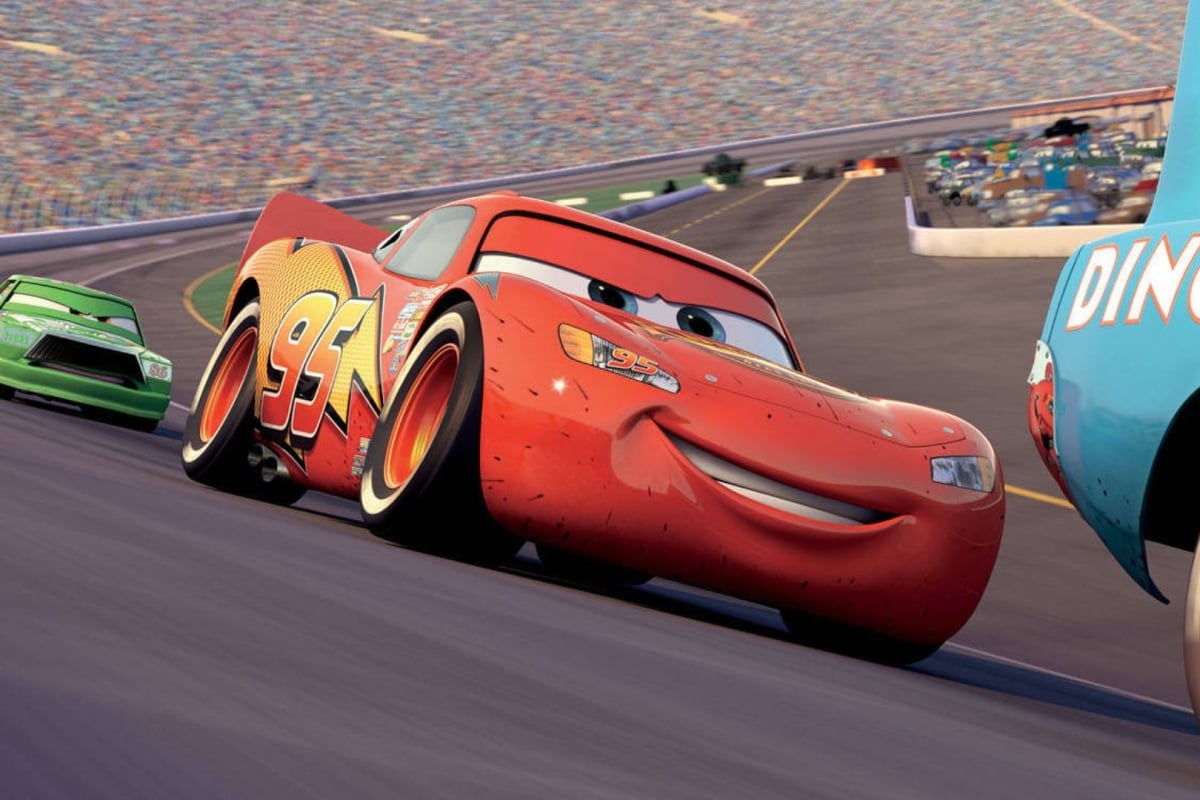 An image of Lightning McQueen racing in the Disney movie Cars