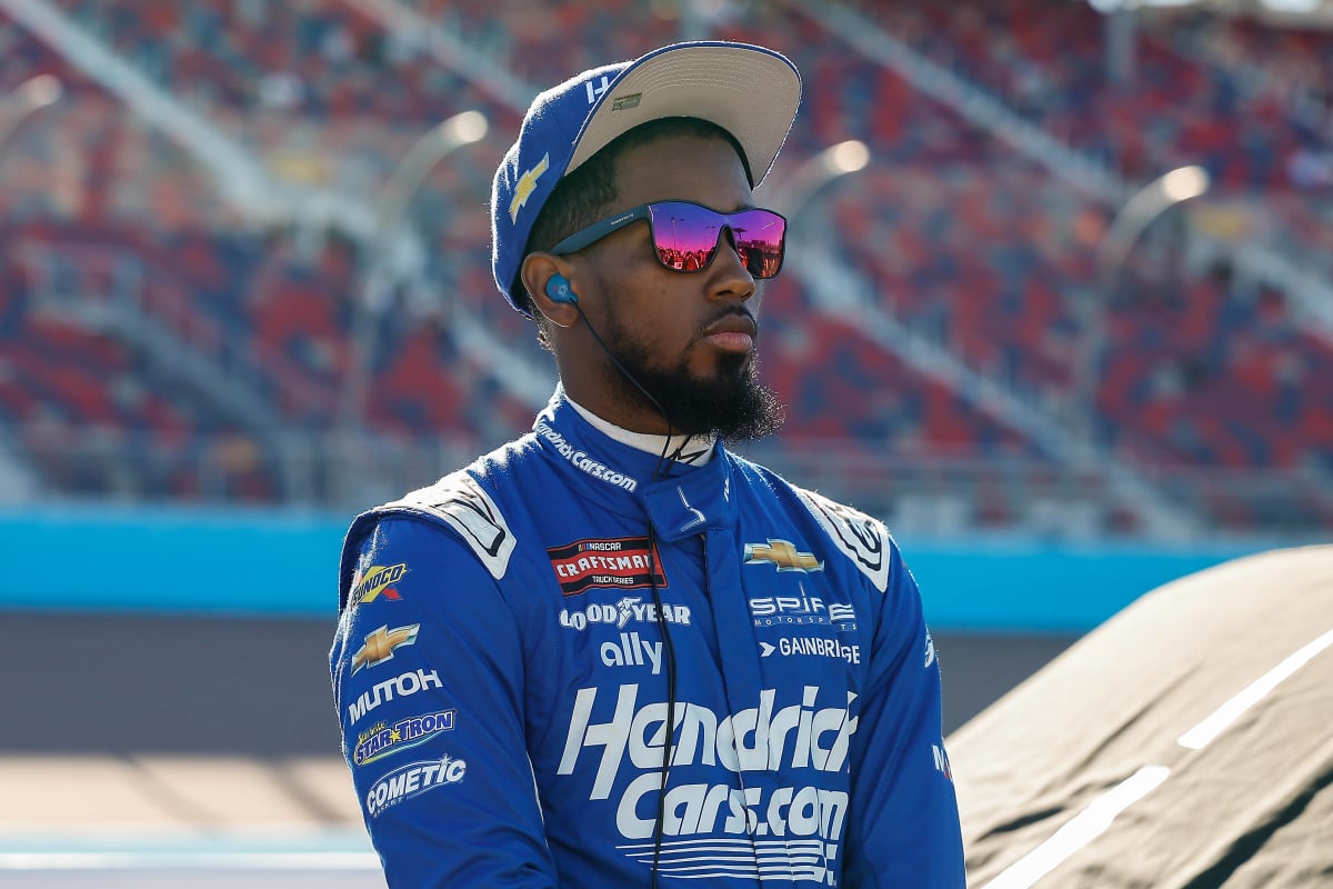 An image of NASCAR driver Rajah Caruth in Hendrickcars.com gear
