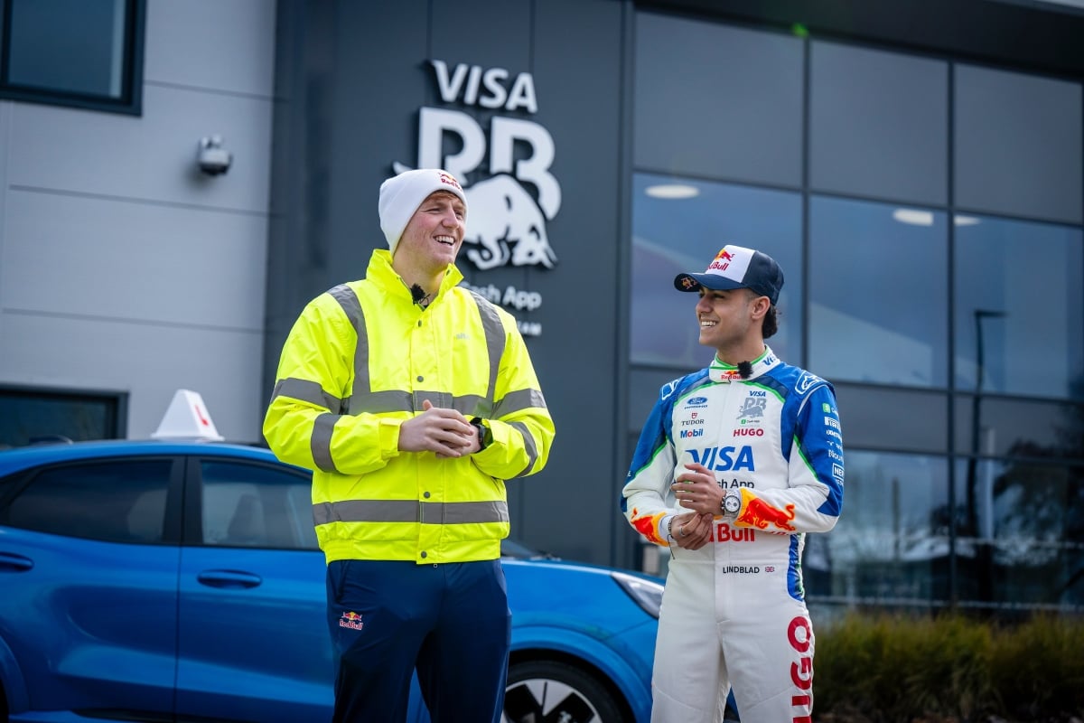 Arvid Lindblad and Angry Ginge laughing outside the Racing Bulls factory