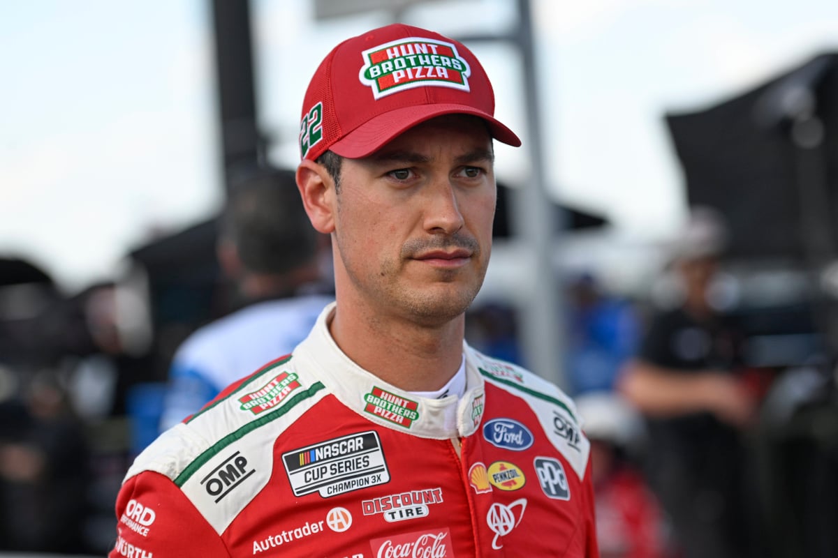 An image of NASCAR Cup Series driver Joey Logano staring into the distance