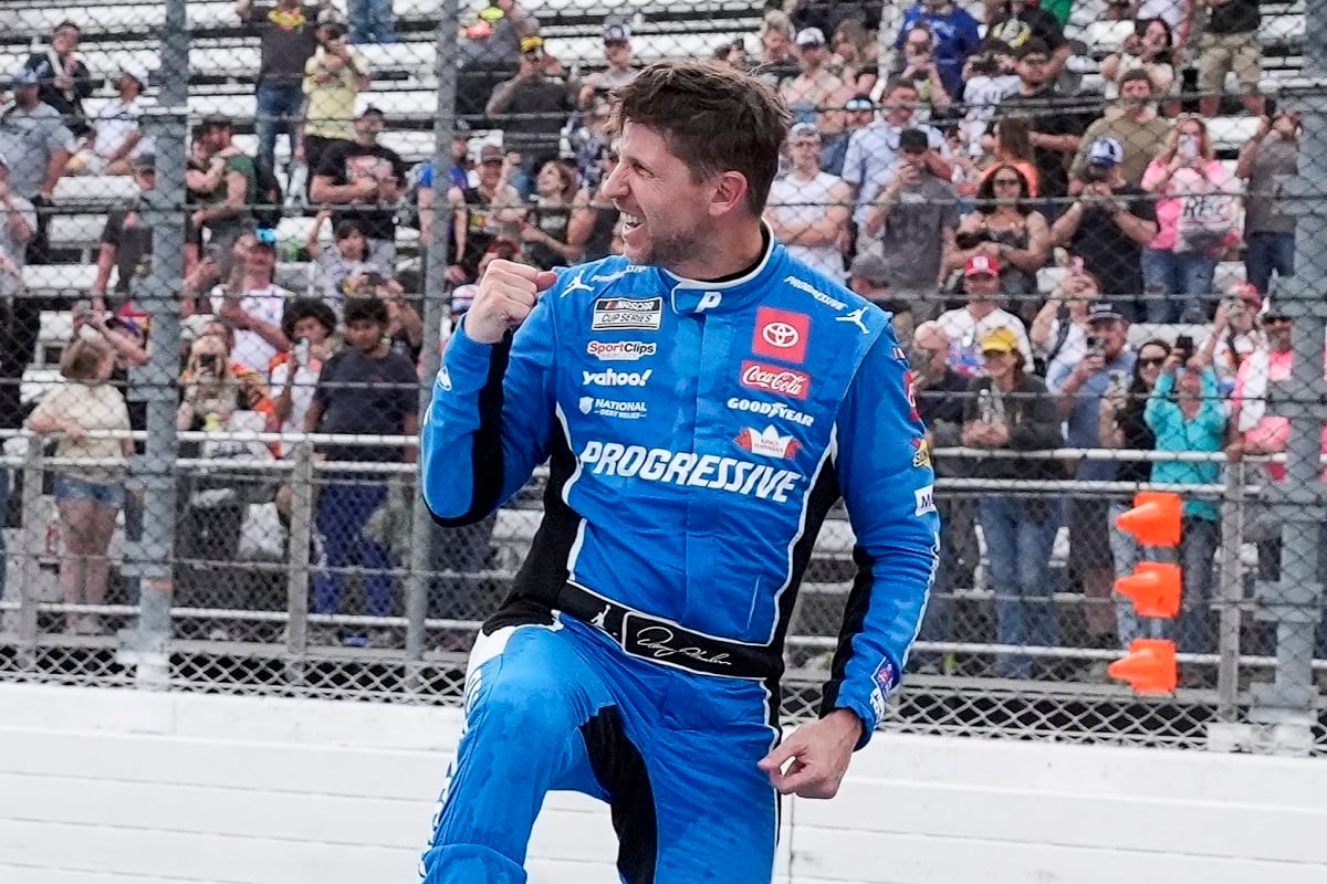 An image of Denny Hamlin celebrating a NASCAR victory