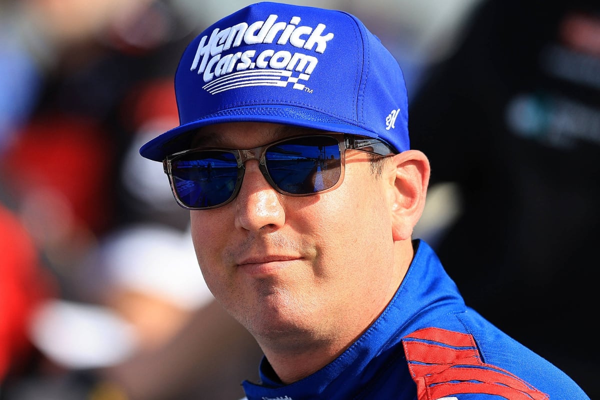 An image of NASCAR legend Kyle Busch smiling during a race weekend