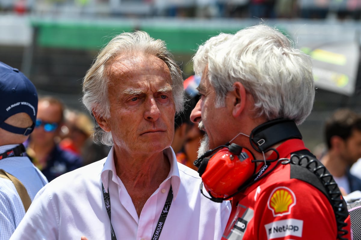 Ex-Ferrari chairman Luca di Montezemolo chats with engineers on the grid