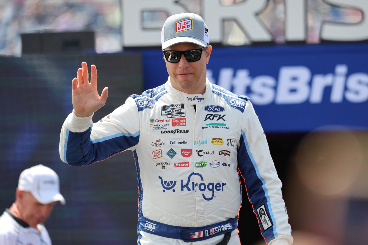 An image of NASCAR driver Brad Keselowski waving to the crowd at Bristol Motor Speedway