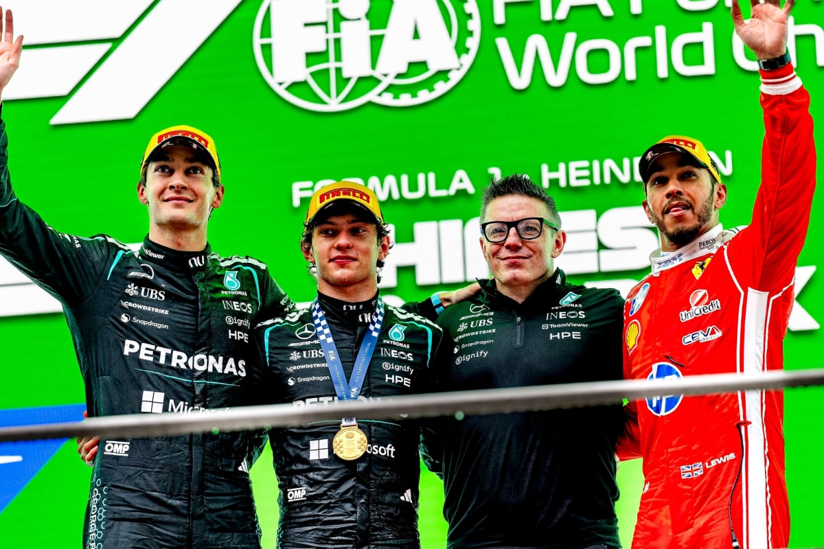 Antonelli, Russell, Hamilton and Bono all embracing on the 2026 Chinese GP podium