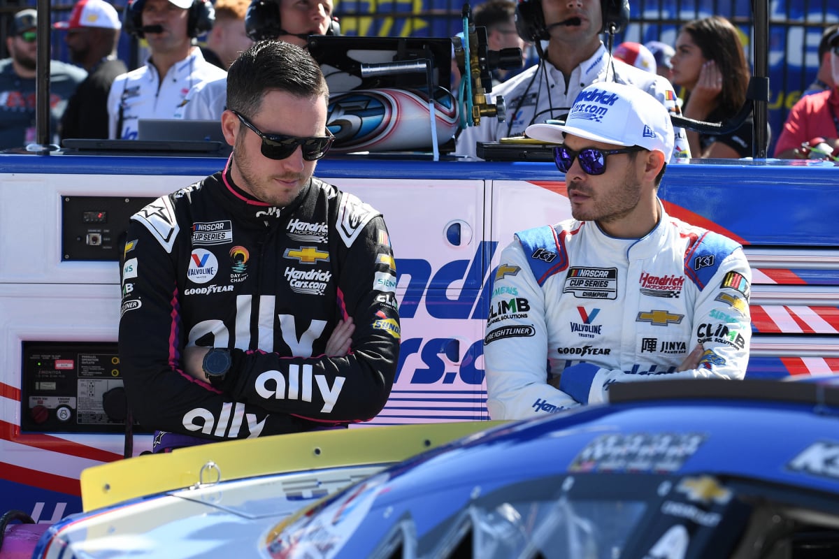 An image of Hendrick Motorsports drivers Alex Bowman and Kyle Larson looking disappointed
