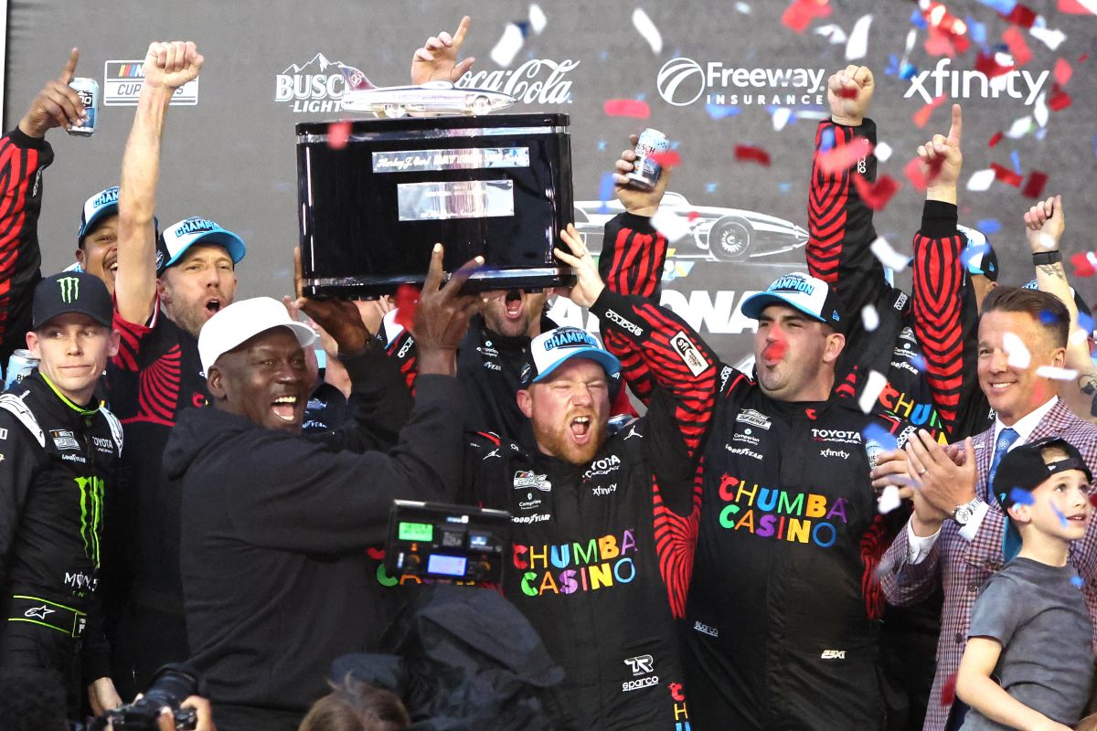 An image of 23xi driver Tyler Reddick and owner Michael Jordan celebrating a win at the 2026 Daytona 500