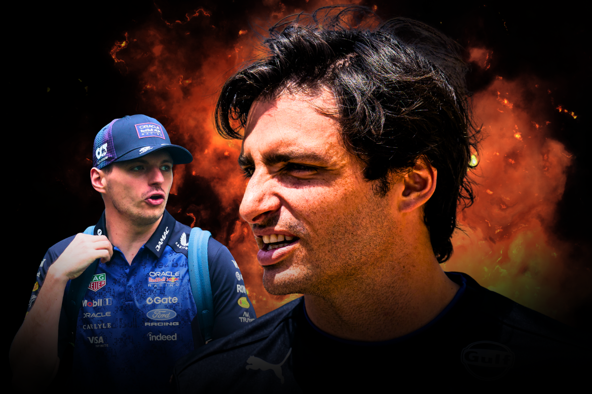 Carlos Sainz looks at Max Verstappen with a disgruntled look