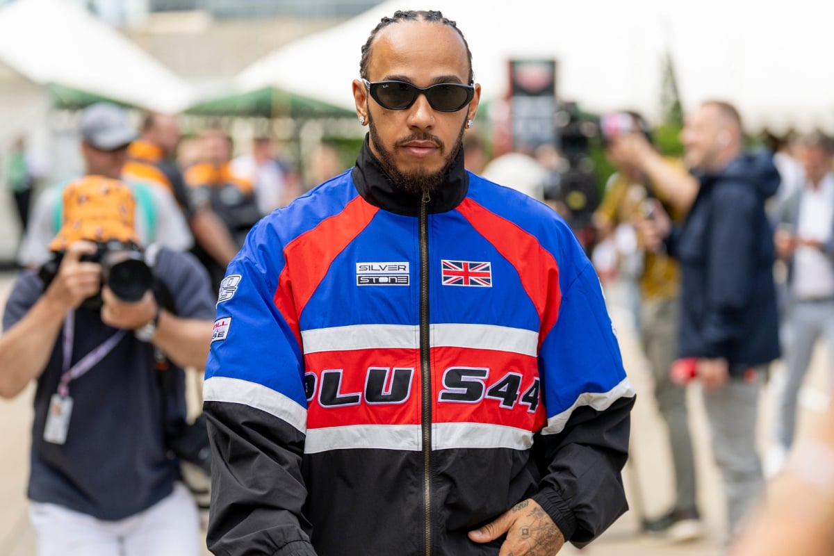 Lewis Hamilton in the Silverstone paddock wearing a Plus 44 jacket