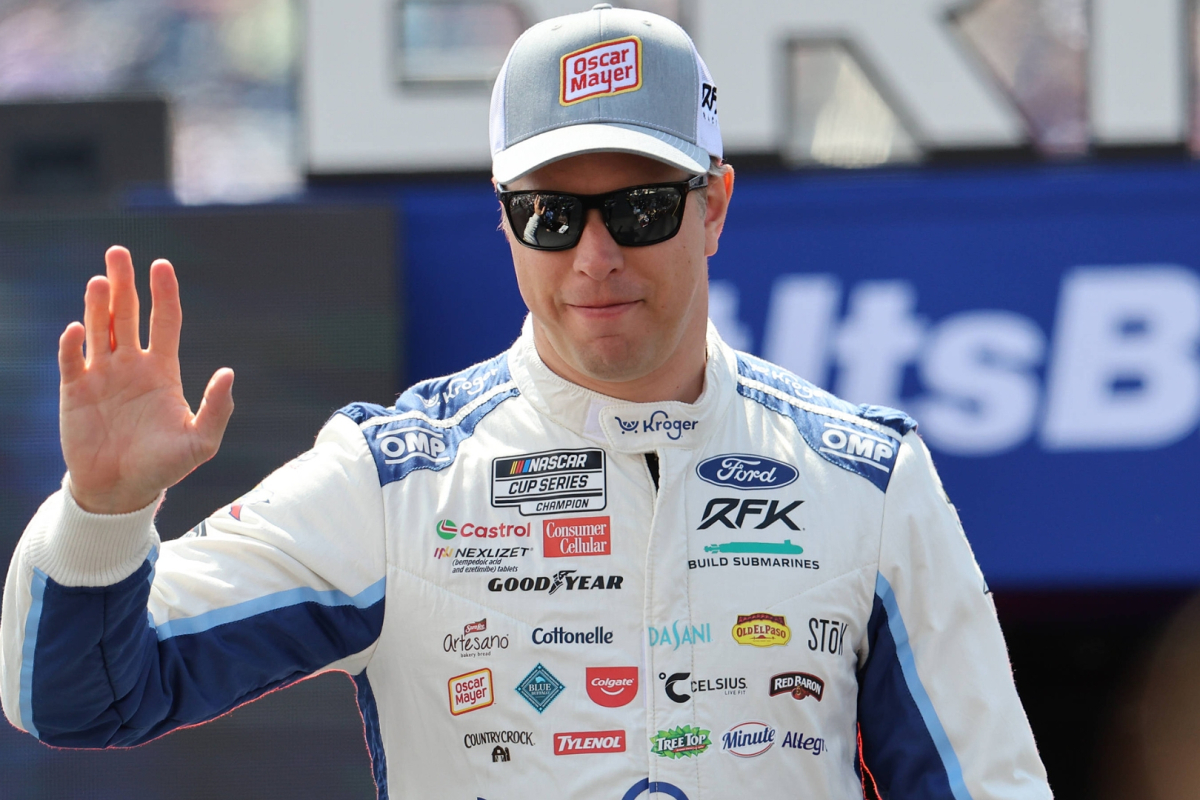 An image of NASCAR driver Brad Keselowski waving to the crowd at Bristol Motor Speedway