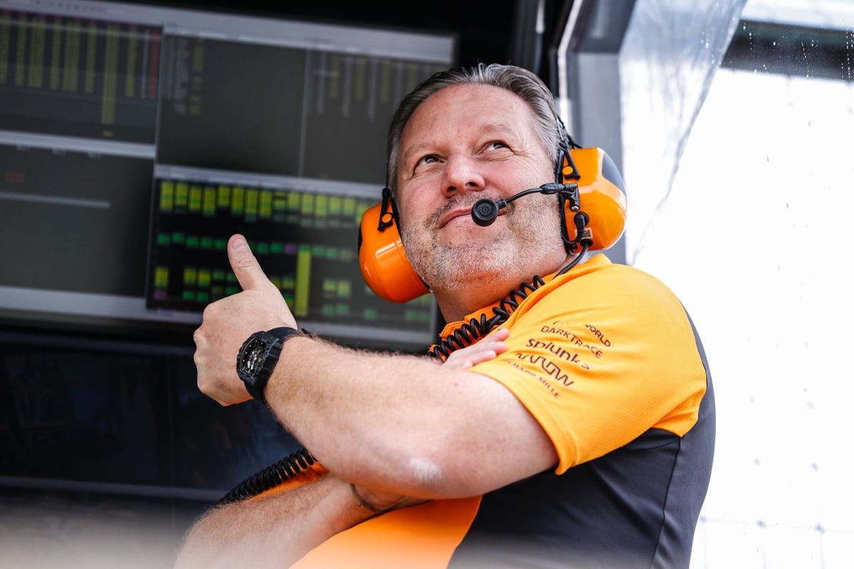 Zak Brown gives the thumbs up from the McLaren pitwall