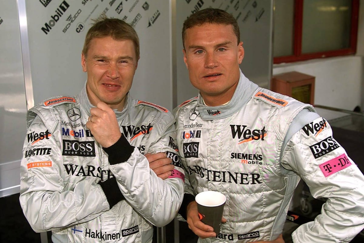 Hakkinen and Coulthard stood together in 2001 McLaren race suits