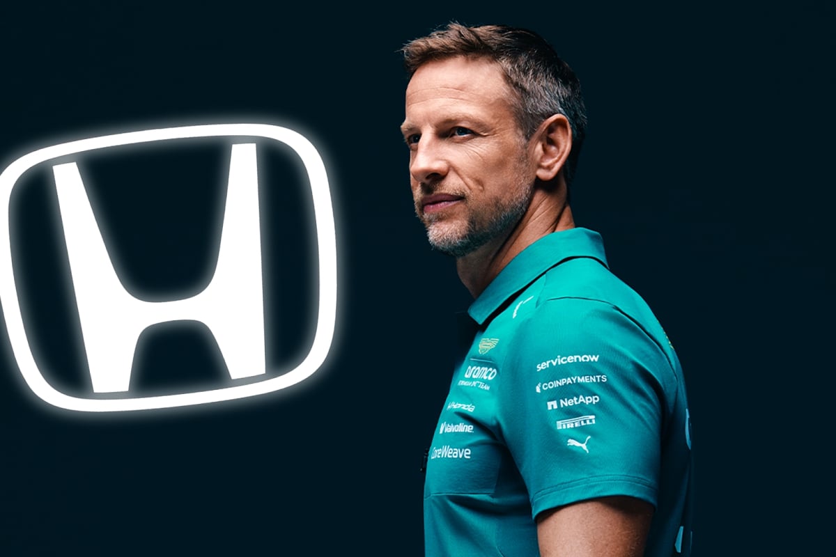 Button in green Aston Martin f1 t-shirt looking sideways with black background and white glowing Honda logo to his left
