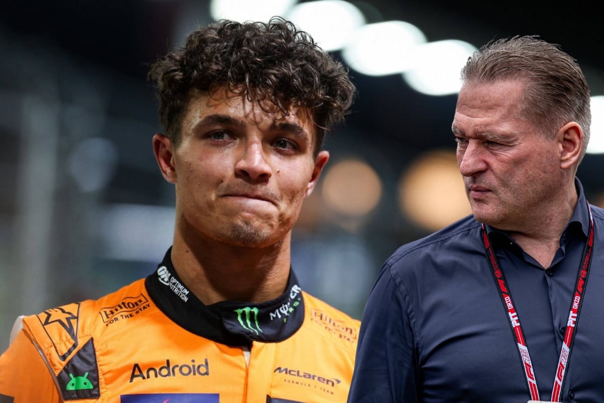 Lando Norris looks sheepish as Jos Verstappen glances over at him