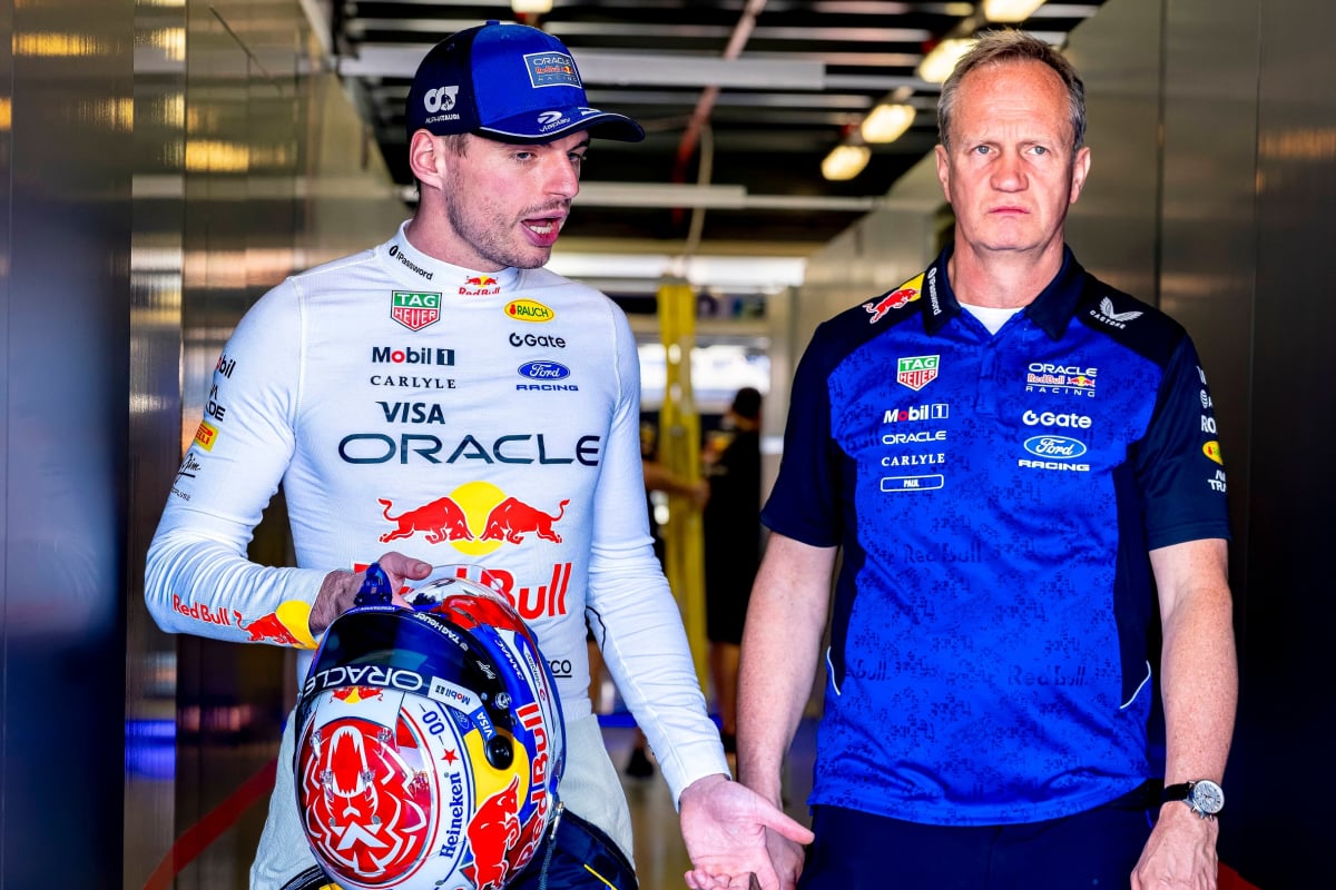 Verstappen in deep conversation with chief engineer Monaghan walking through Red Bull F1 garage