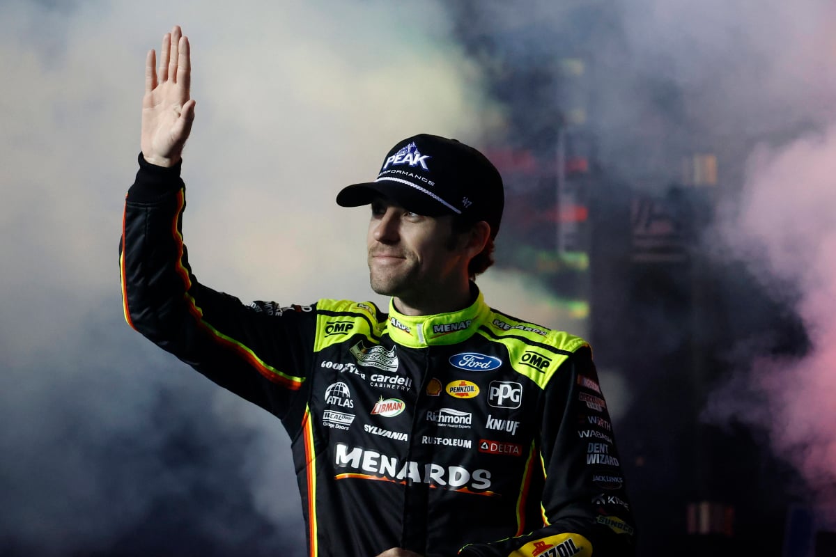 An image of NASCAR driver Ryan Blaney waving to the crowd at Daytona