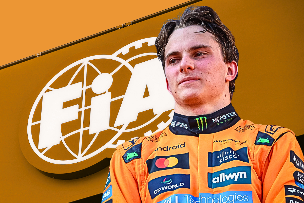 Oscar Piastri in front of the FIA flag 