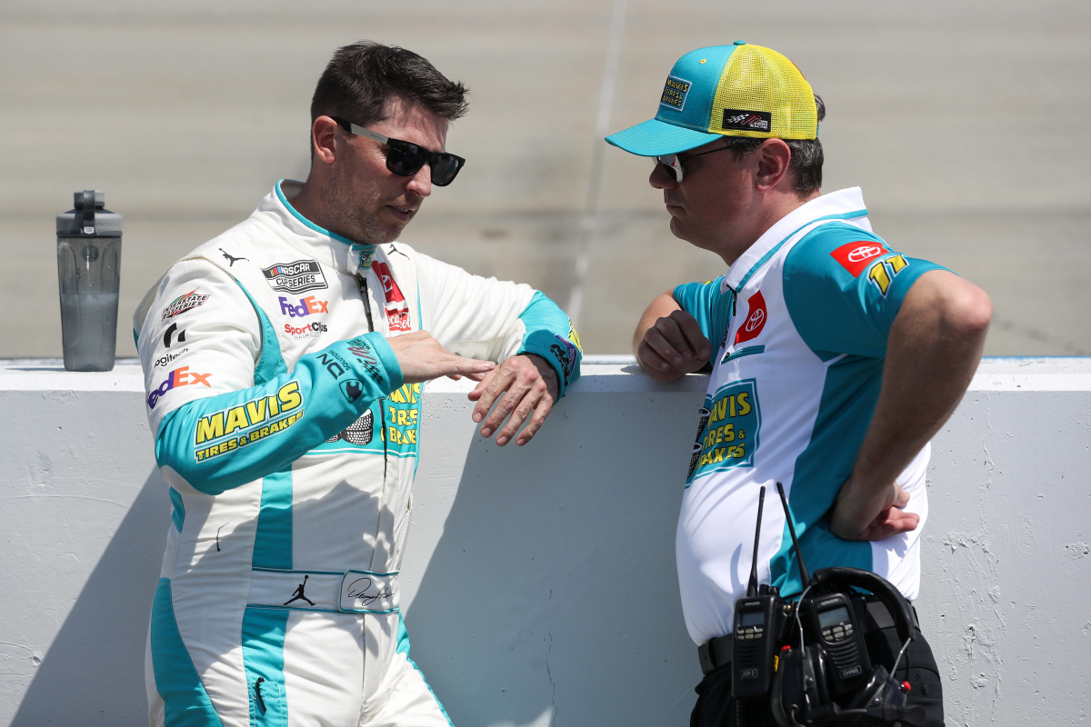 An image of Denny Hamlin and at the time crew chief Chris Gabehart in discussion in 2024